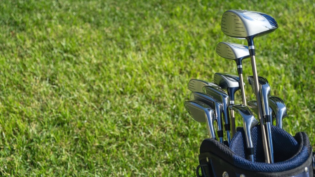 golf sticks on green grass golf course close up view 1 1.jpg